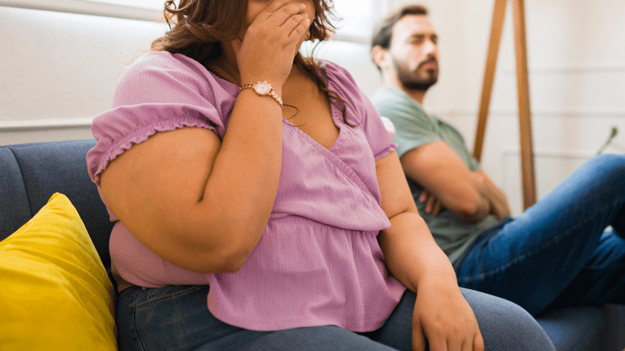 upset woman on couch with man