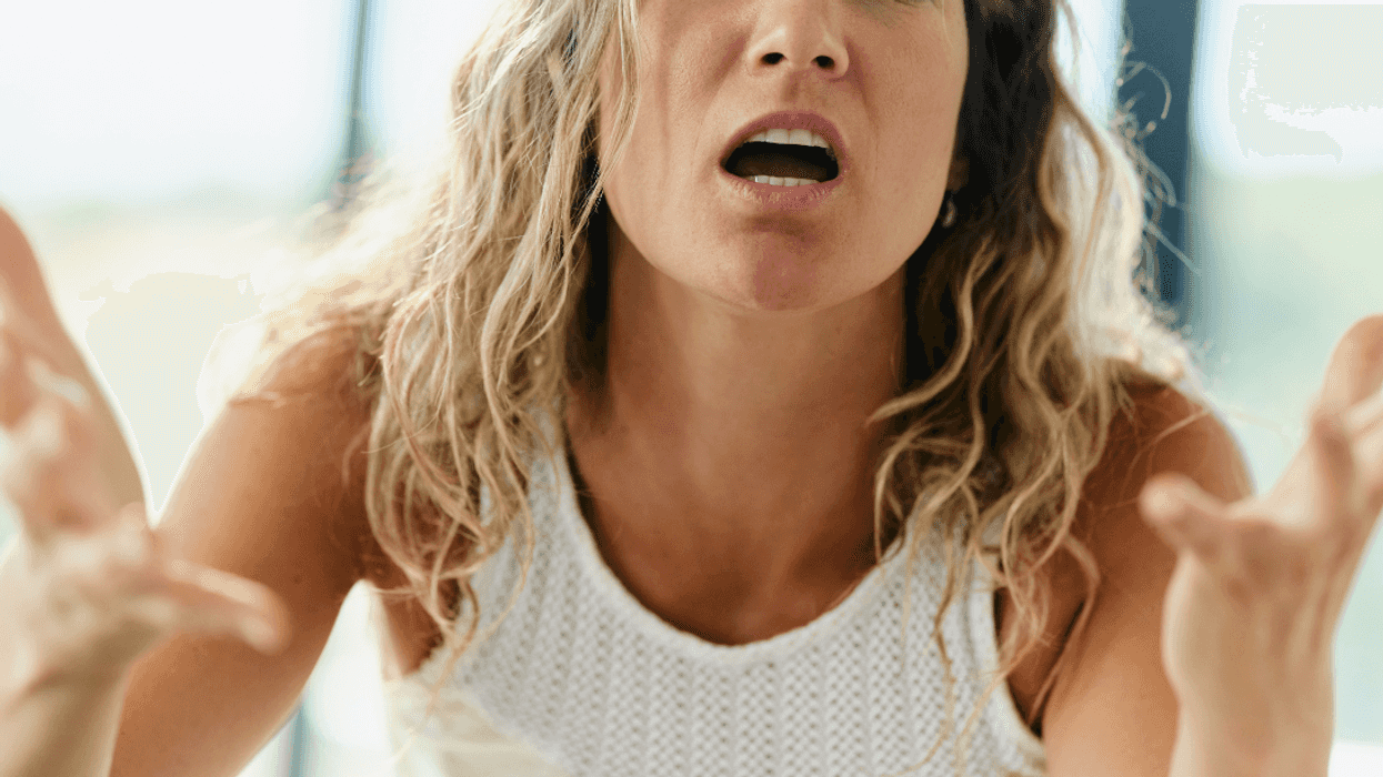 upset woman pleading with unseen person