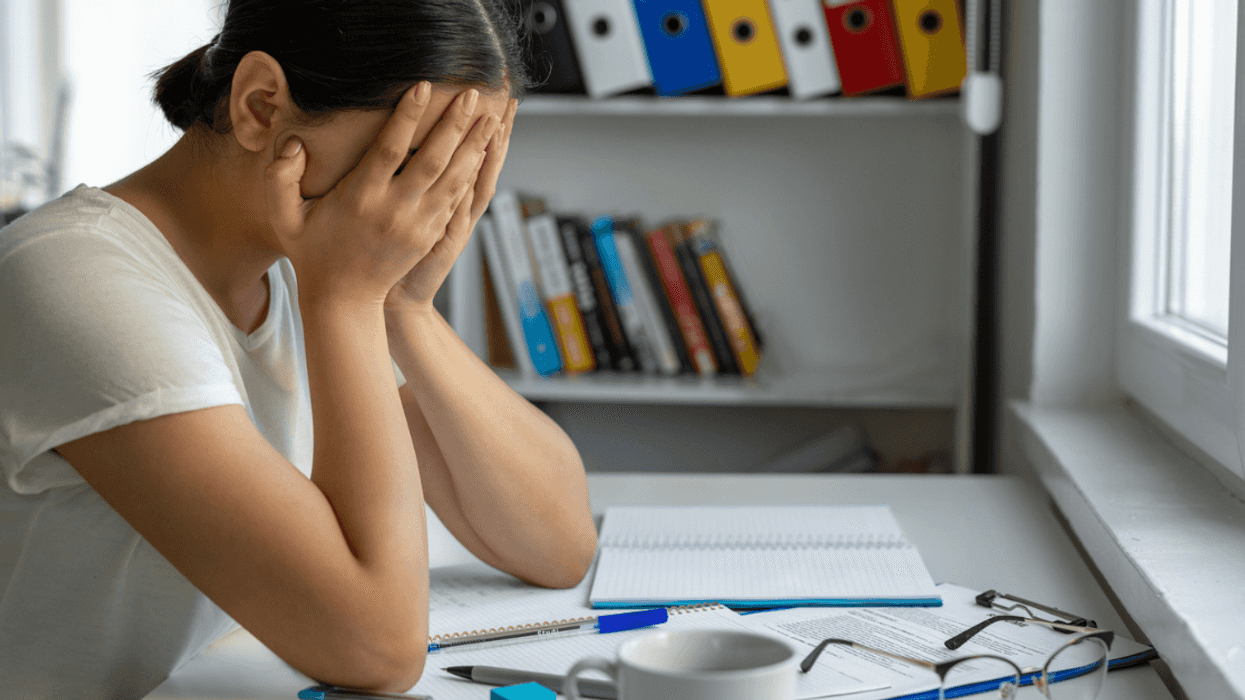 Upset woman sitting in classroom