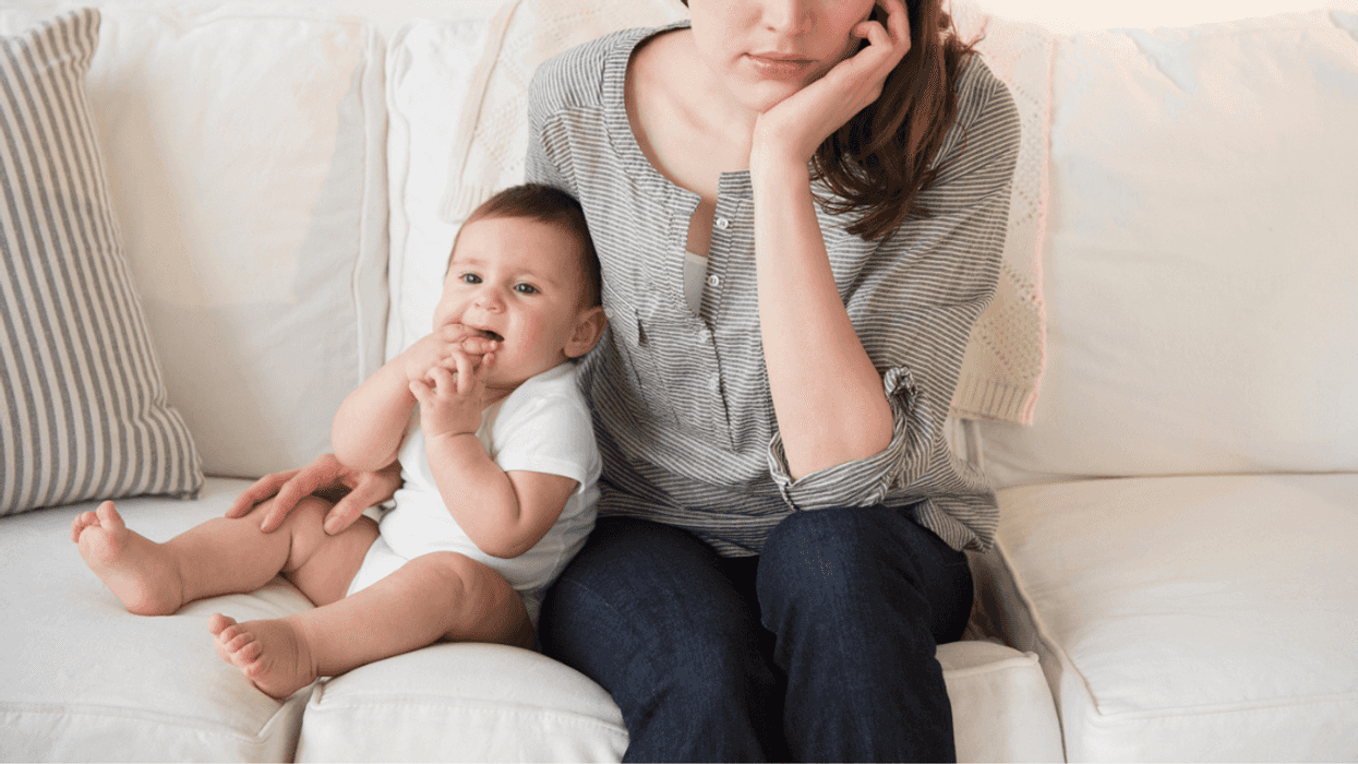 Upset woman with baby