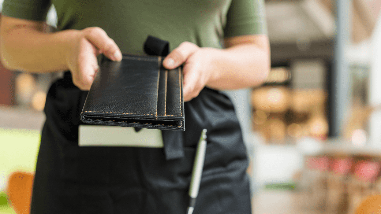Waitress holding check