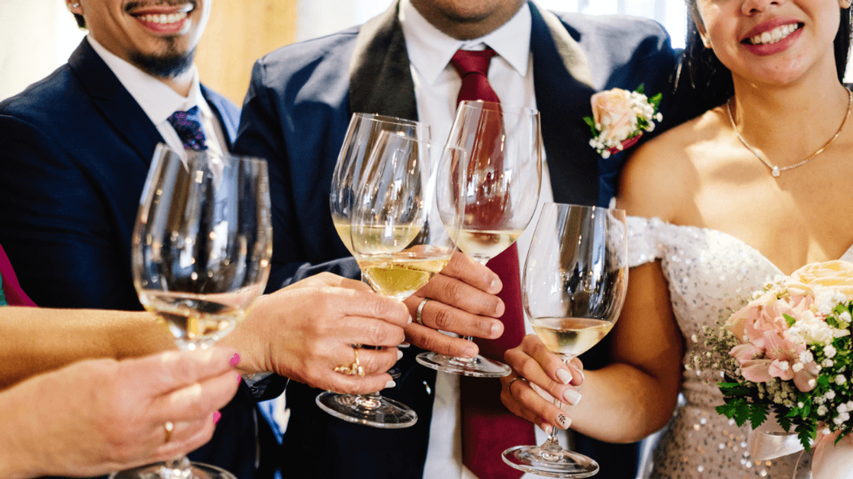 wedding party makes champagne toast at reception