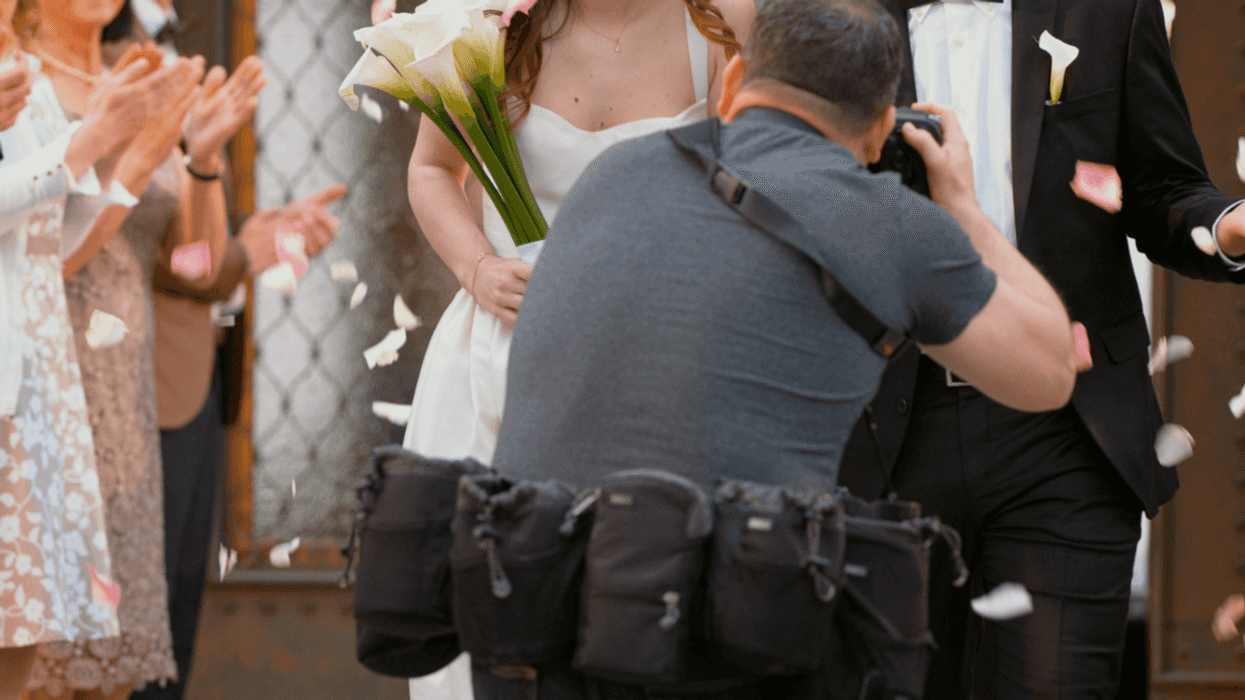 Wedding photographer taking a picture.
