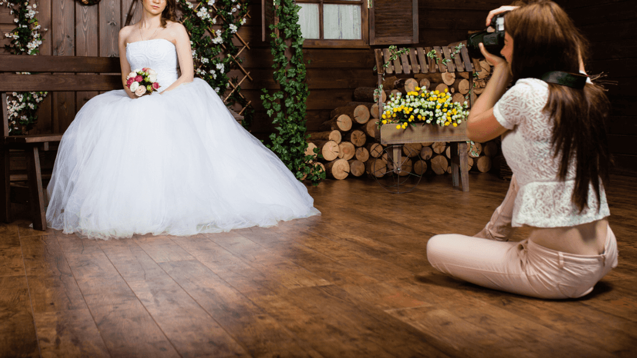 wedding photographer taking photos of bride