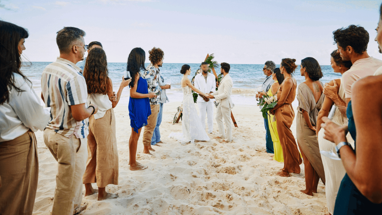 wedding taking place on a tropical beach