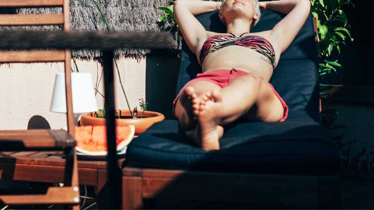 Woman Balks After Neighbor's Adult Daughter Berates Her For Tanning In A Bikini In Her Own Yard