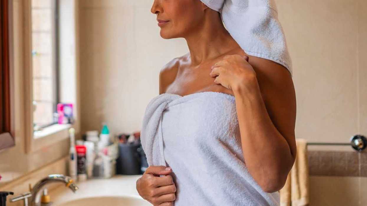 Woman after shower with towel wrapped around her head