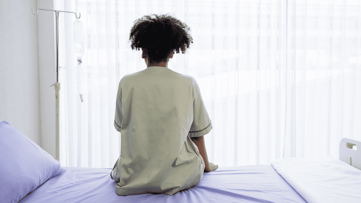 Woman alone in hospital room