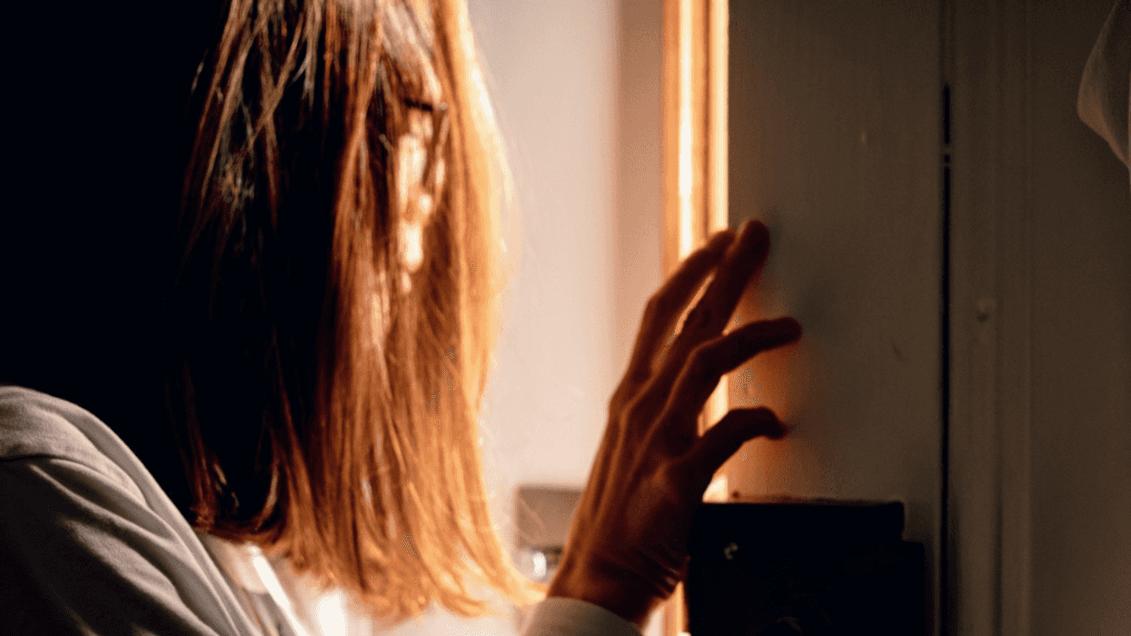 woman answering apartment door late at night