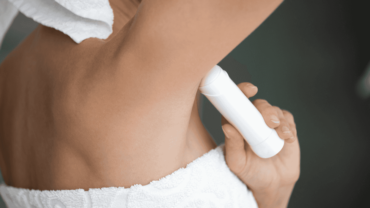 Woman applying deoderant