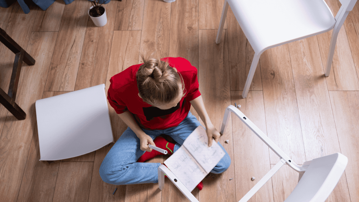 Woman assembling furniture