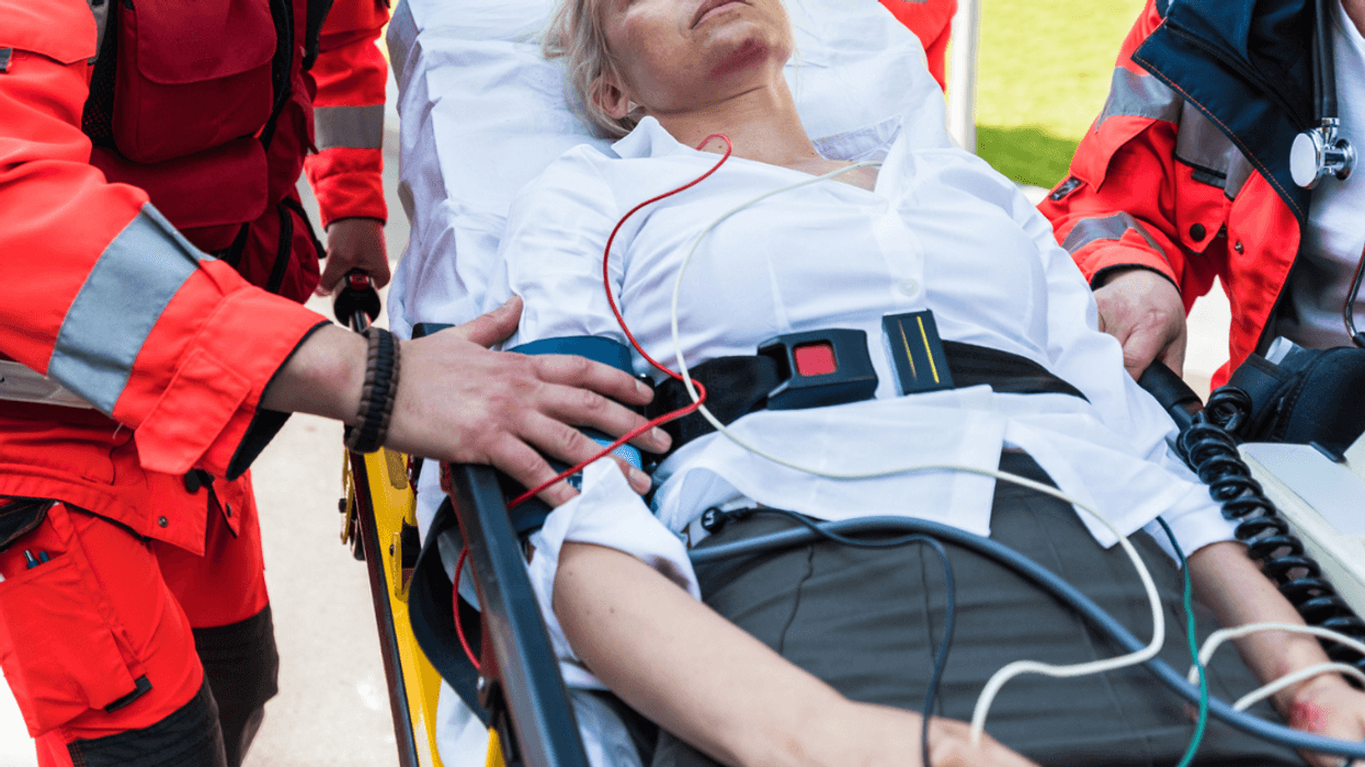 Woman being escorted by an Emergency Medical Team