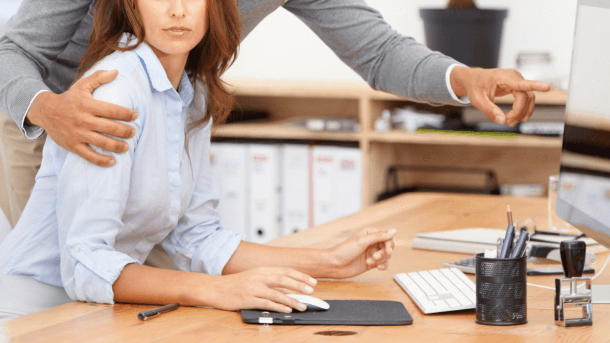 Woman being harrassed by a man at work
