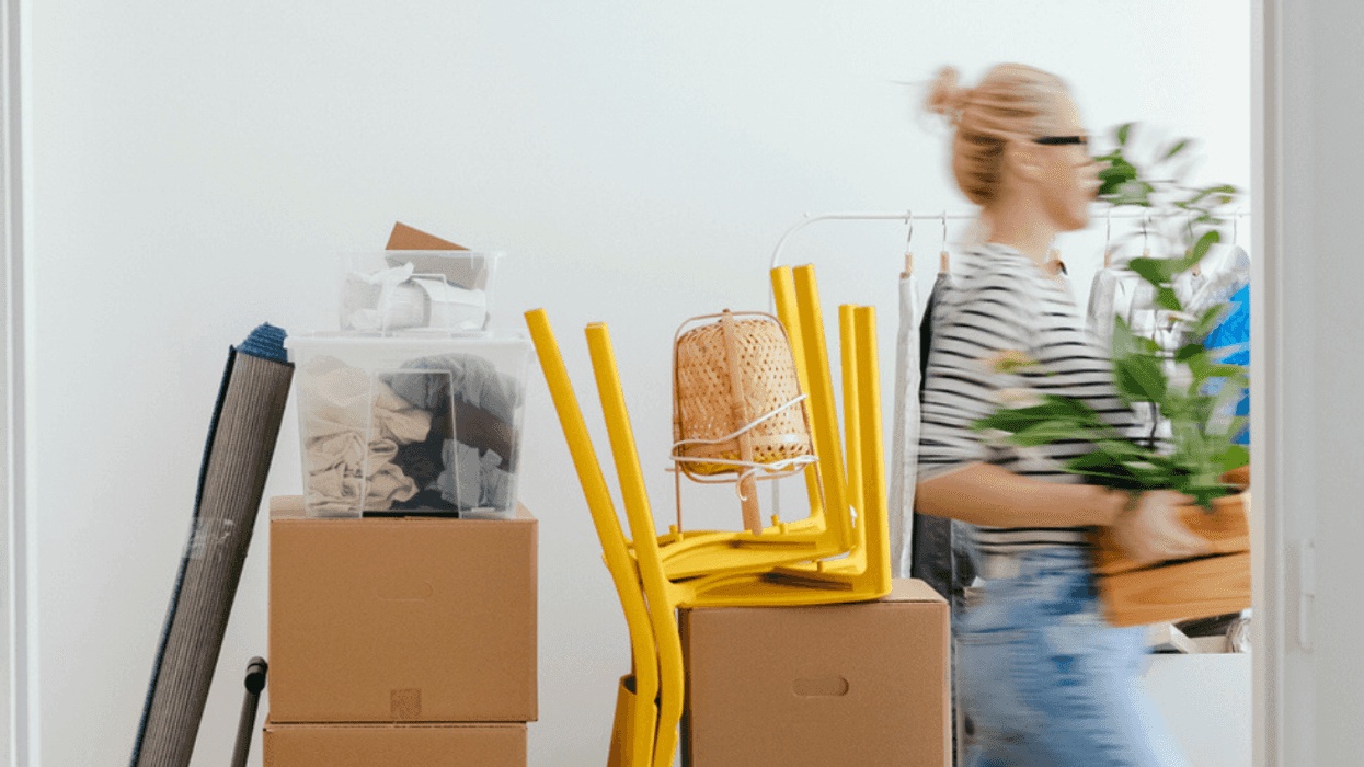 Woman carrying moving boxes
