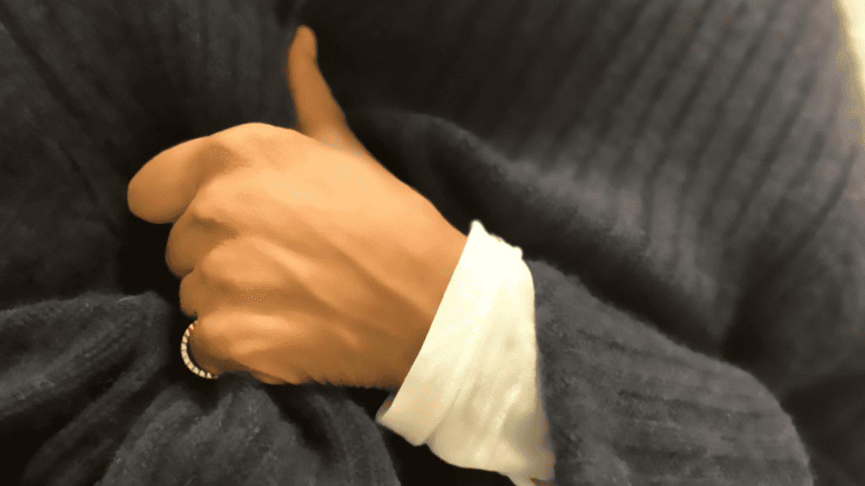 Woman clutching chest and feeling faint