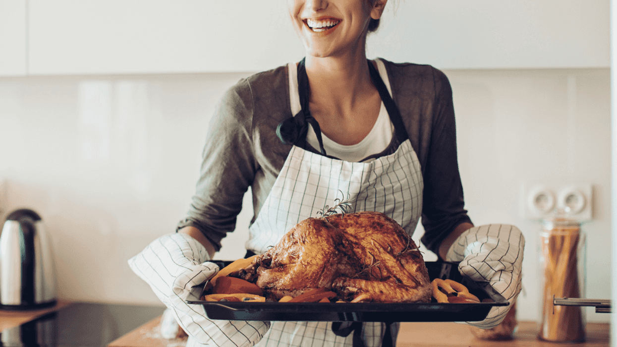 Woman cooking chicken
