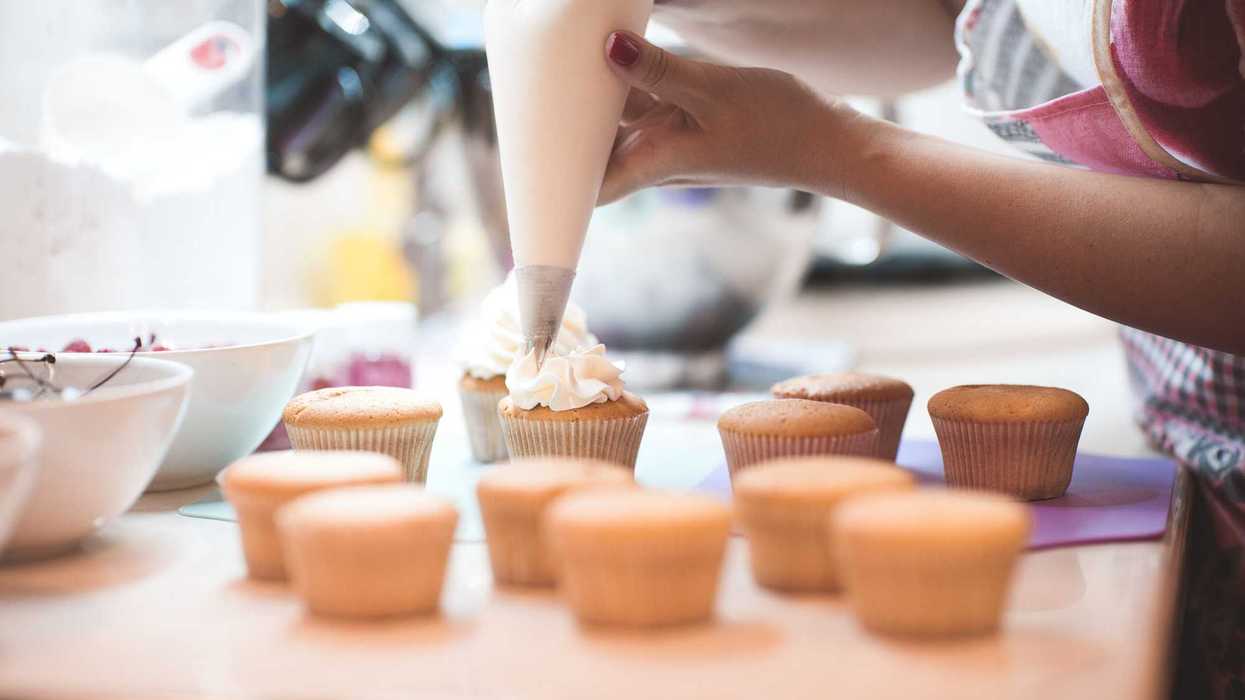 woman decorating cupcakes