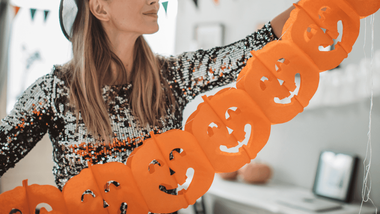 Woman decorating for halloween