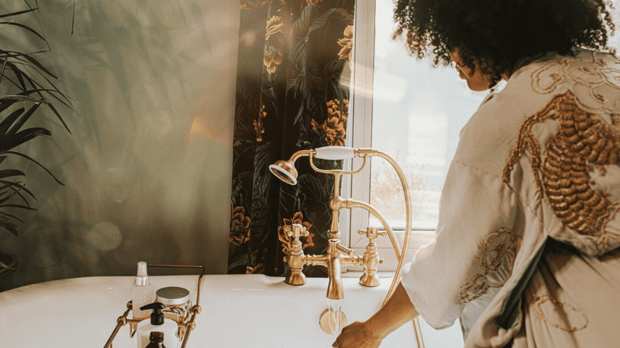 Woman drawing a bath.