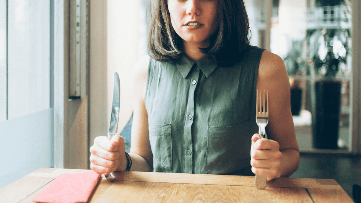 woman eagerly awaits food