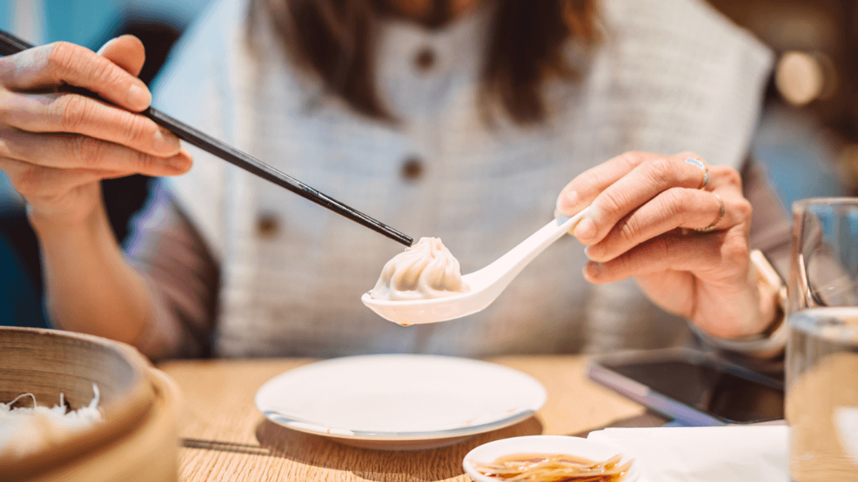 woman eating dumplings
