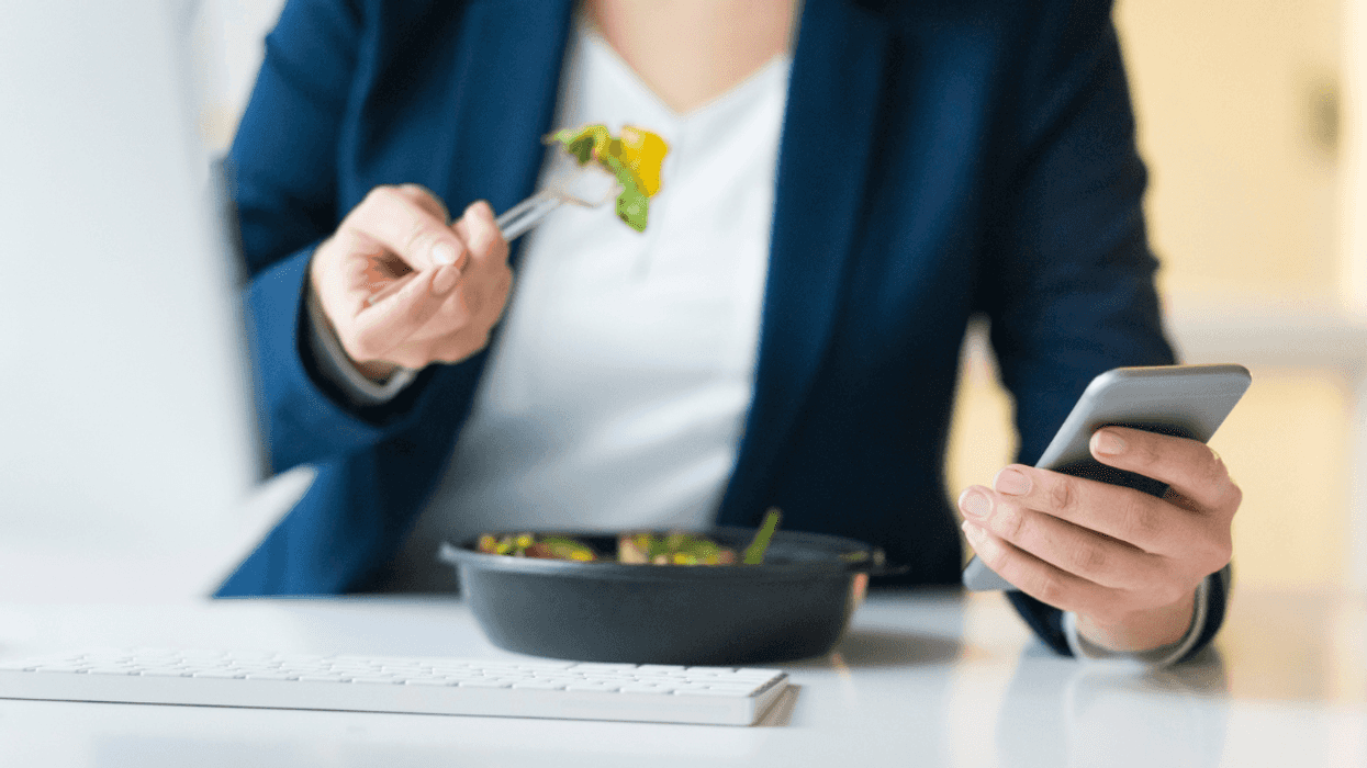 Woman eating lunch during break at work