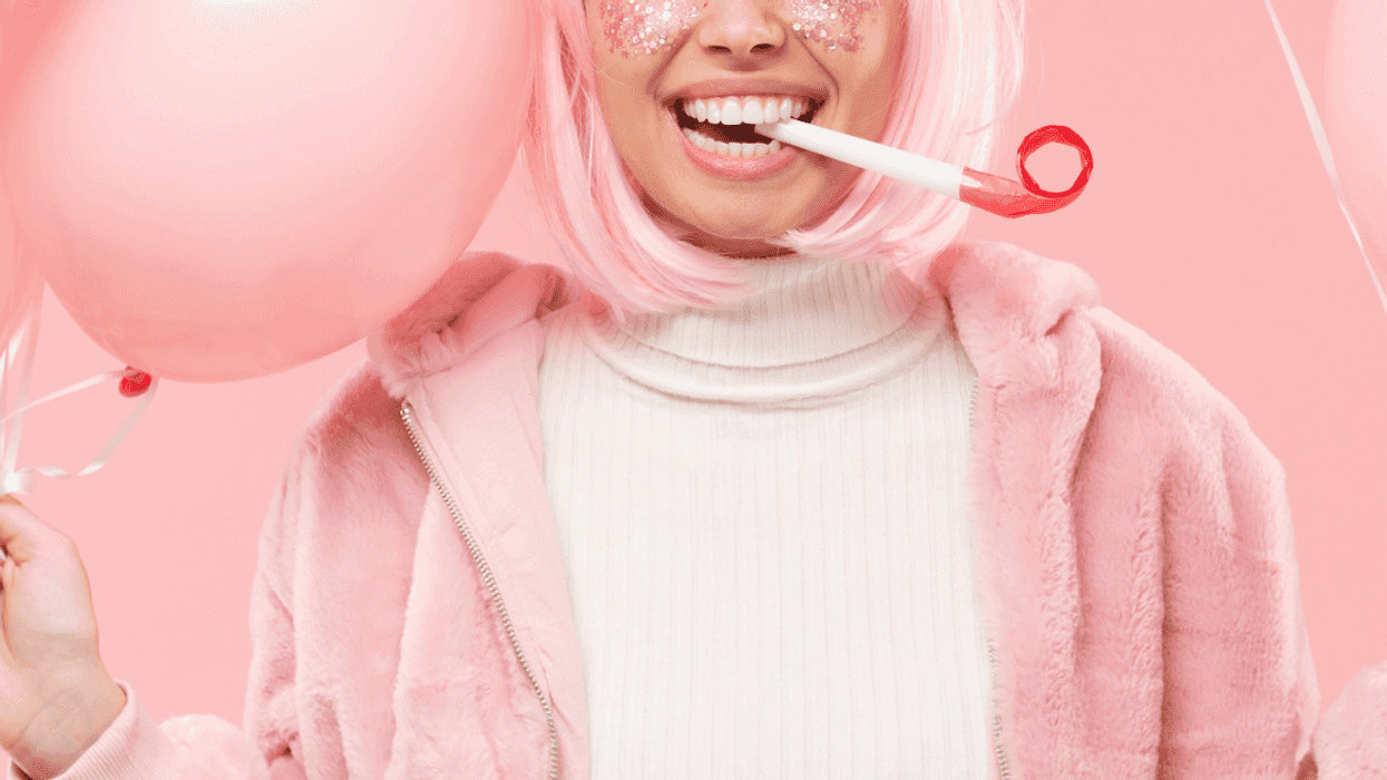 Woman enjoying party with pink decorations