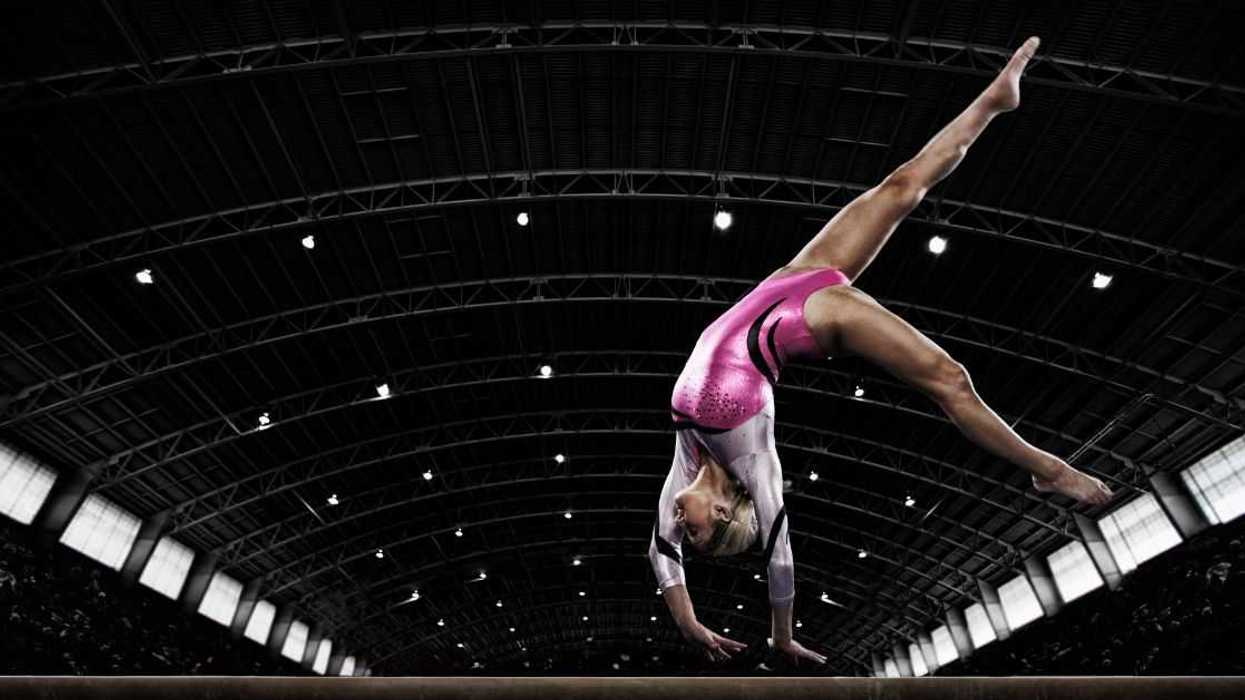 Woman gymnast on balance beam