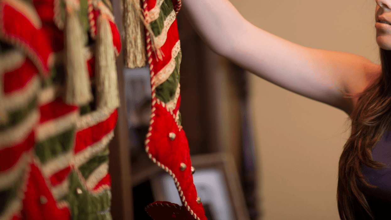 Woman hanging Christmas stockings