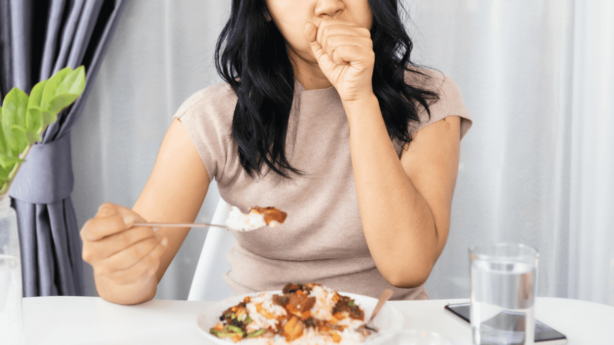 Woman having an allergic reaction at dinner