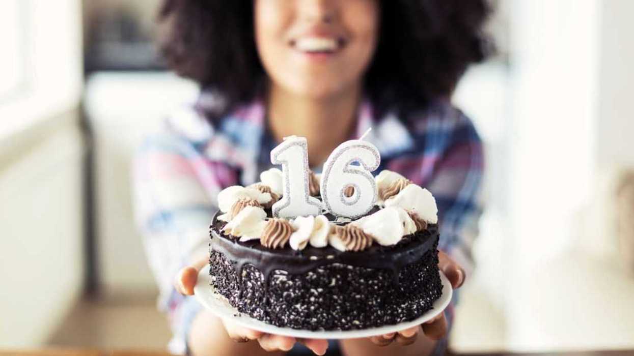 Woman holding a sweet 16 birthday cake