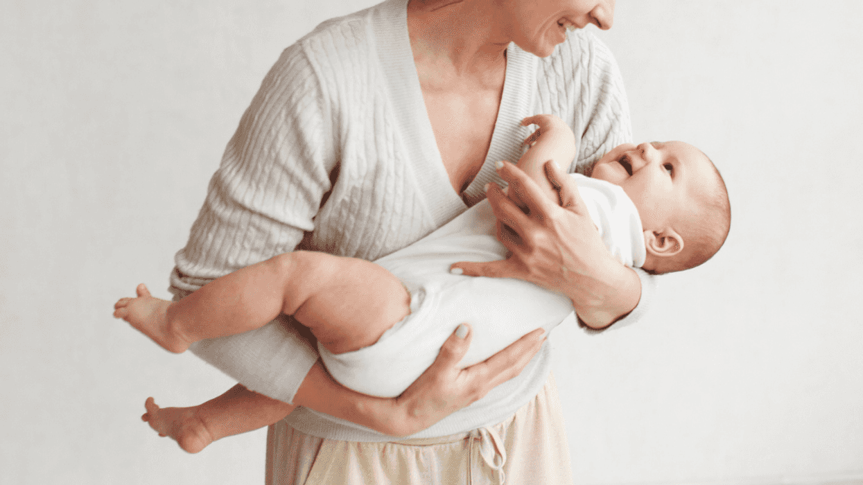 Woman holding baby daughter