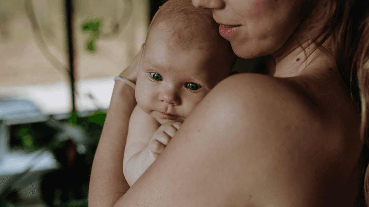 Woman holding her newborn baby
