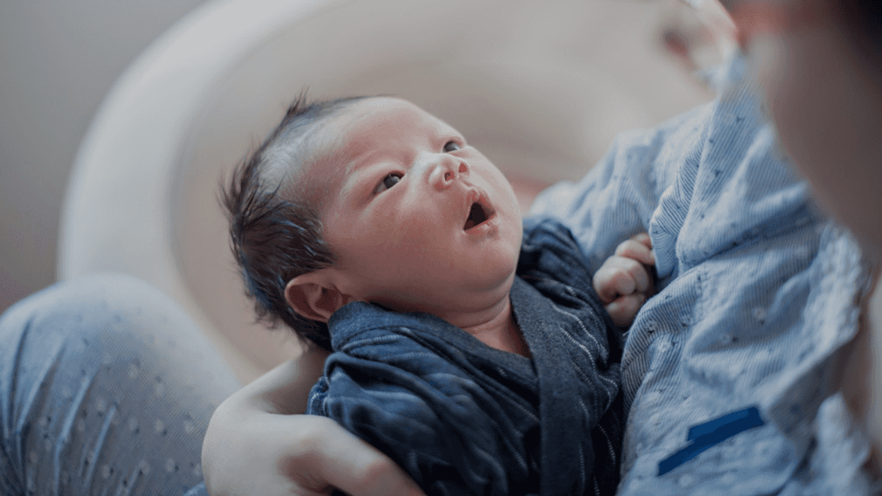 woman holding infant