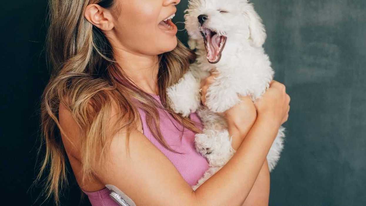 Woman holding pet dog