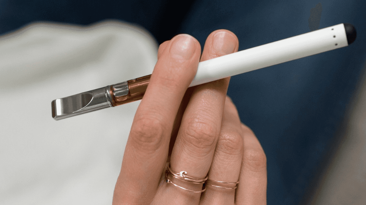 woman holding vape pen