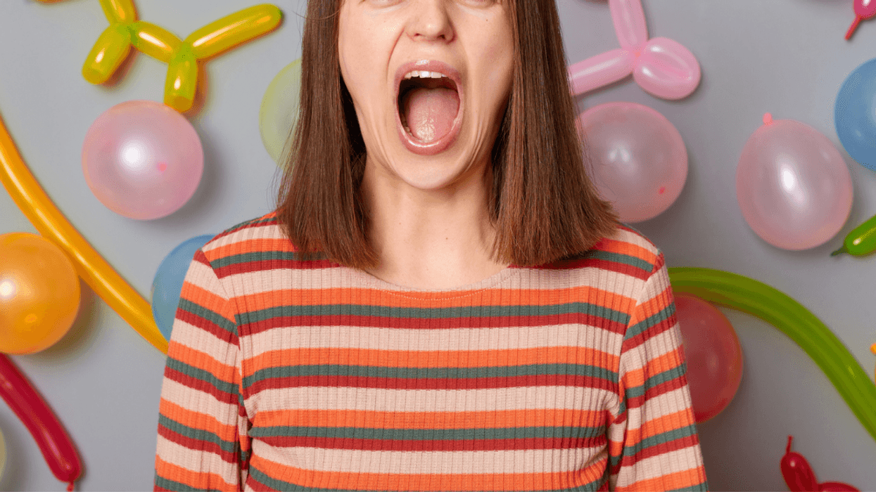 woman in front of balloons