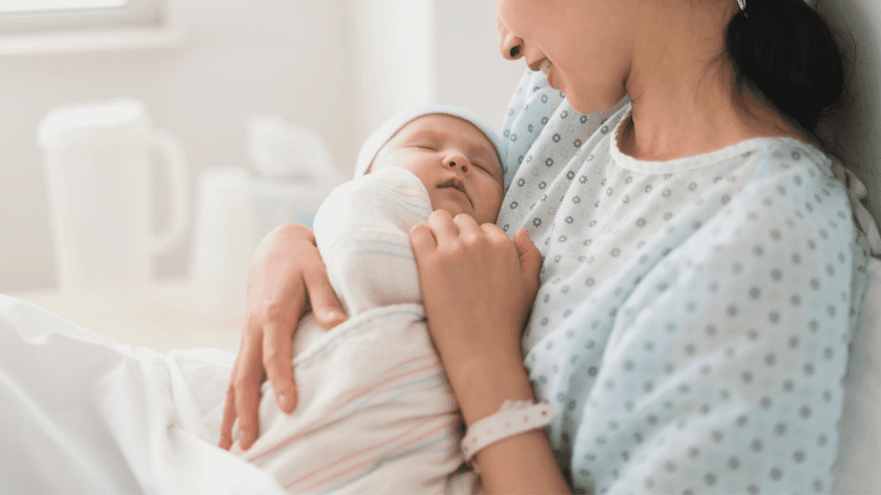 woman in hospital holding baby