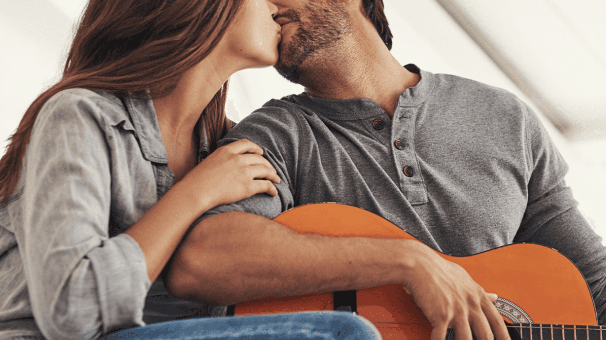 Woman kissing a musician