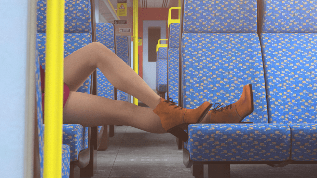 Woman laying her feet on empty train seats.