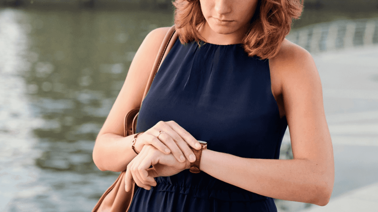 woman looking at watch