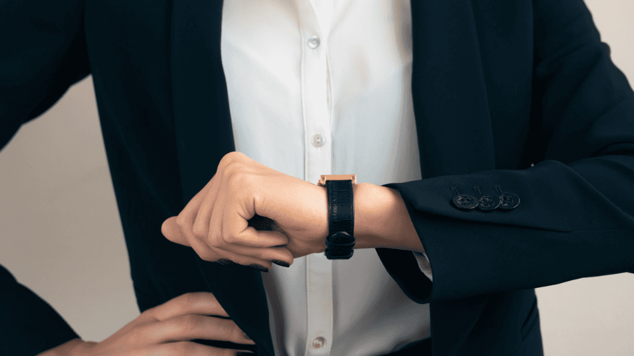 woman looking at watch