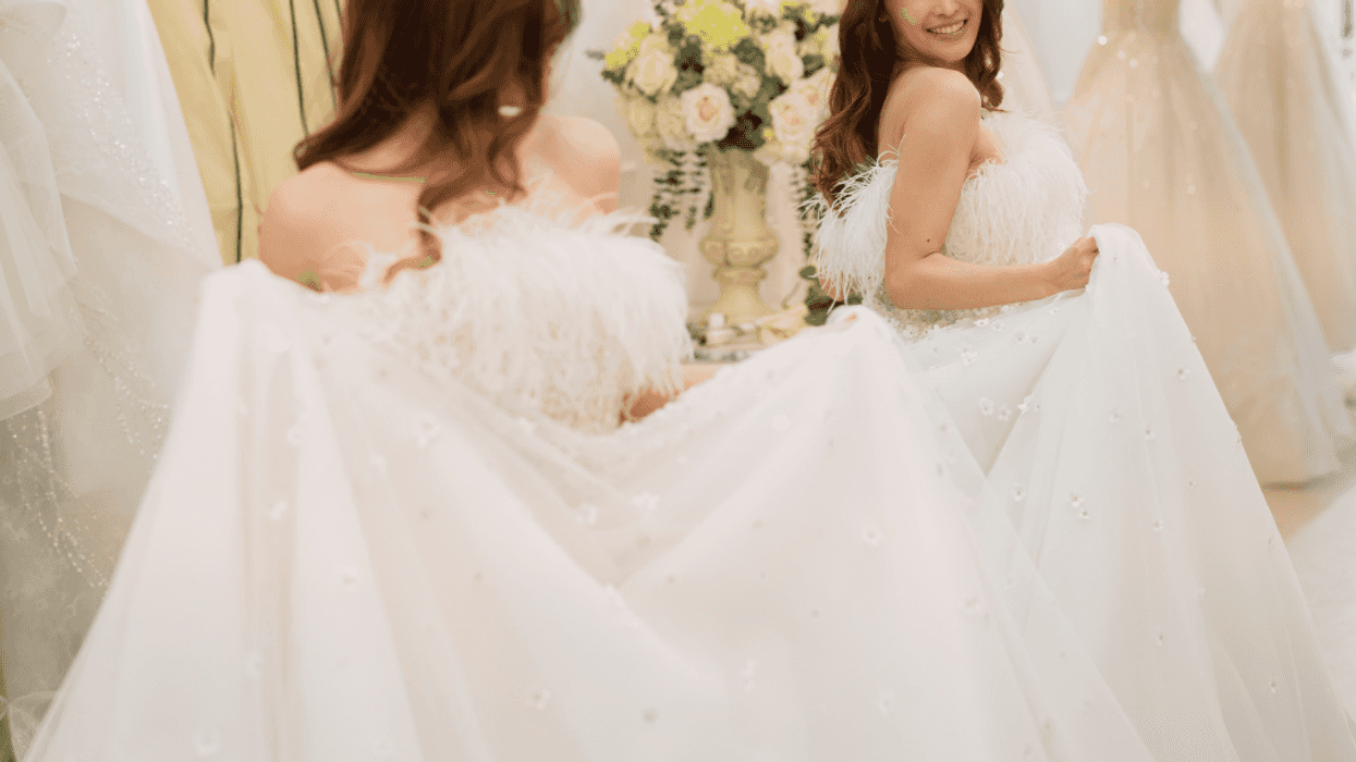 woman looking at wedding dress