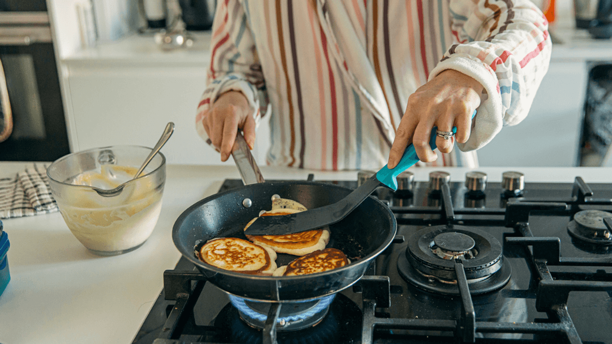 Woman making pancakes for breakfast