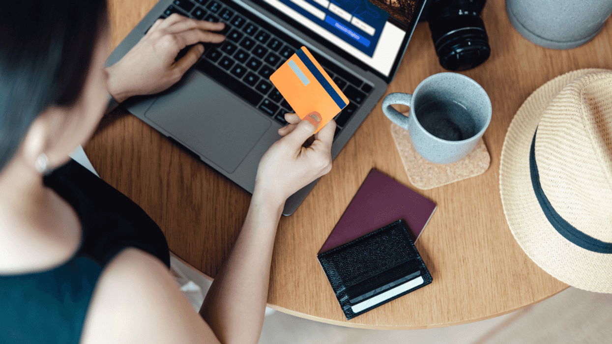 woman making travel arrangements on a laptop