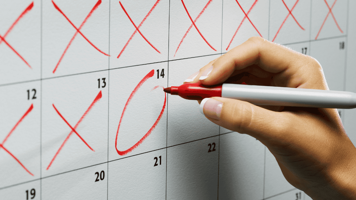 woman marking calendar