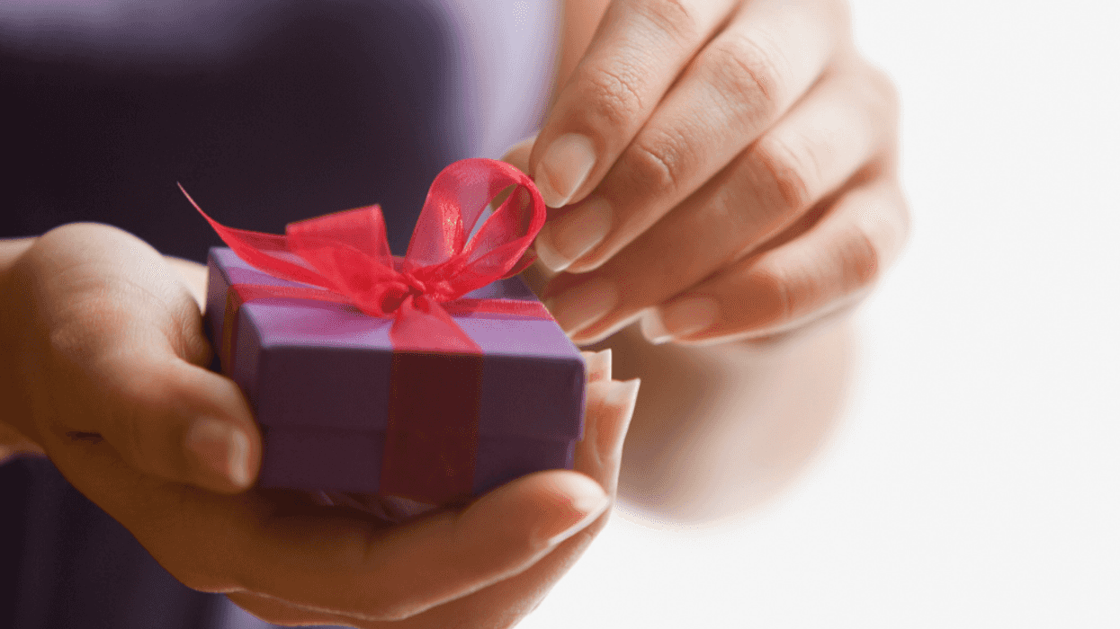 Woman opening a small box.