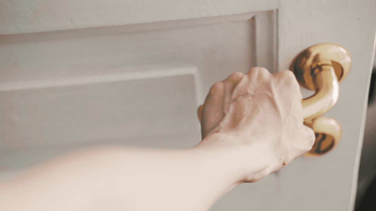 woman opening door