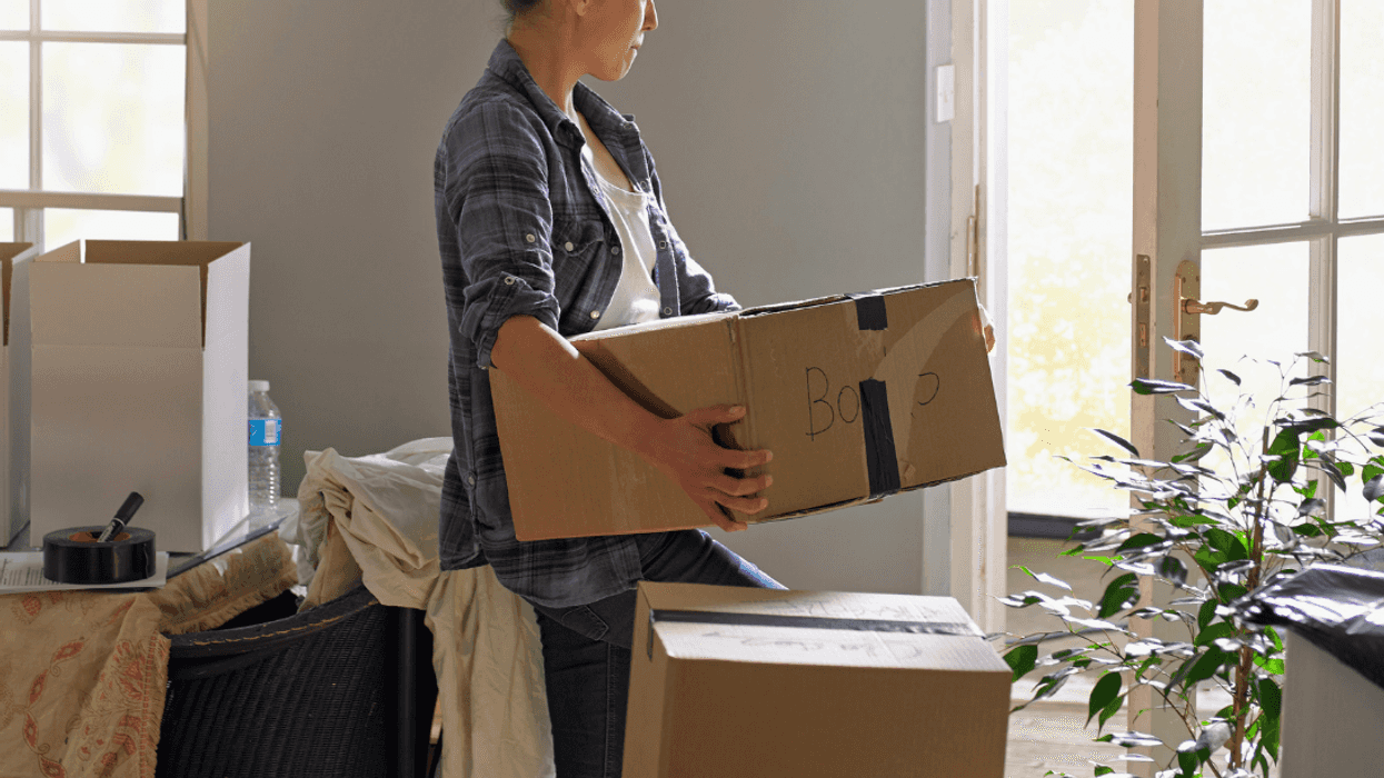 woman packing boxes and moving