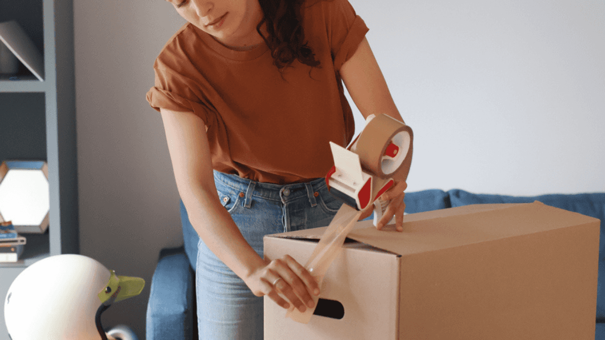 Woman packing boxes